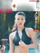 A woman in a black bikini on the cover of a magazine.